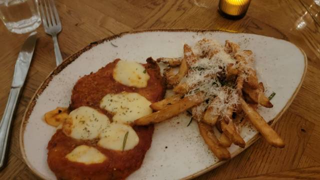 Ella’s by Christian Petroni signature dishes Spicy RigatoniVeal Chop ParmesanTuna CrudoWhipped Ricotta